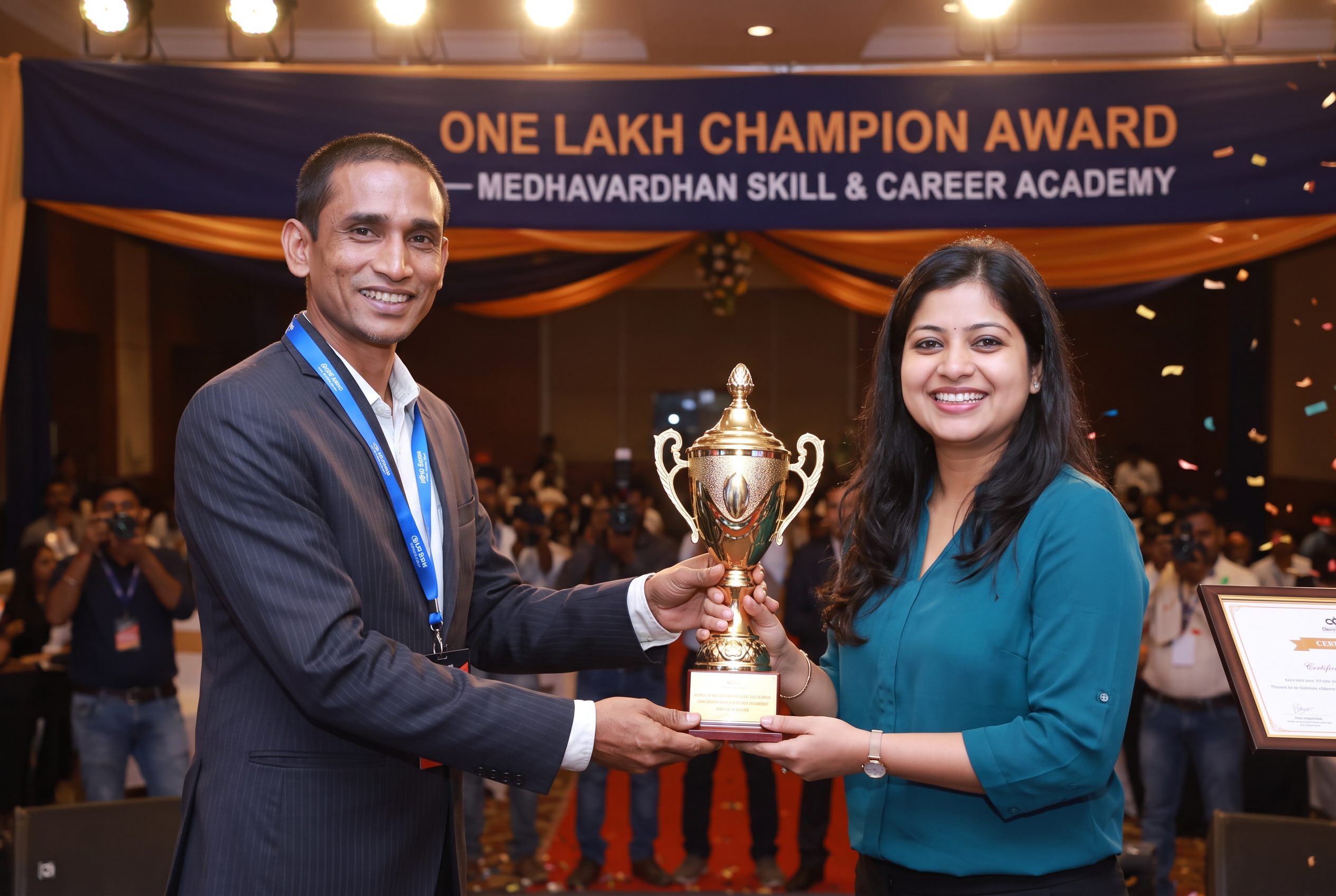 Rituparna Bose receiving the One Lakh Champion Award from the founder of Medhavardhan Skill & Career Academy